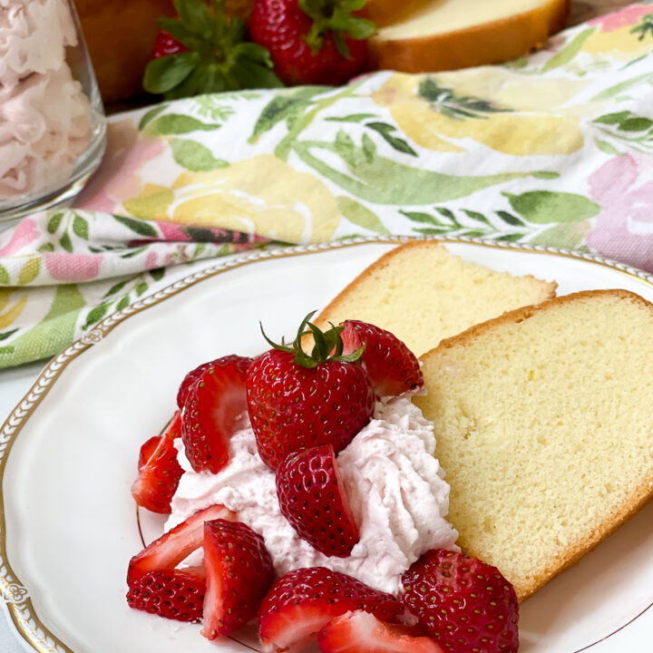 whipped cream on cake with strawberries