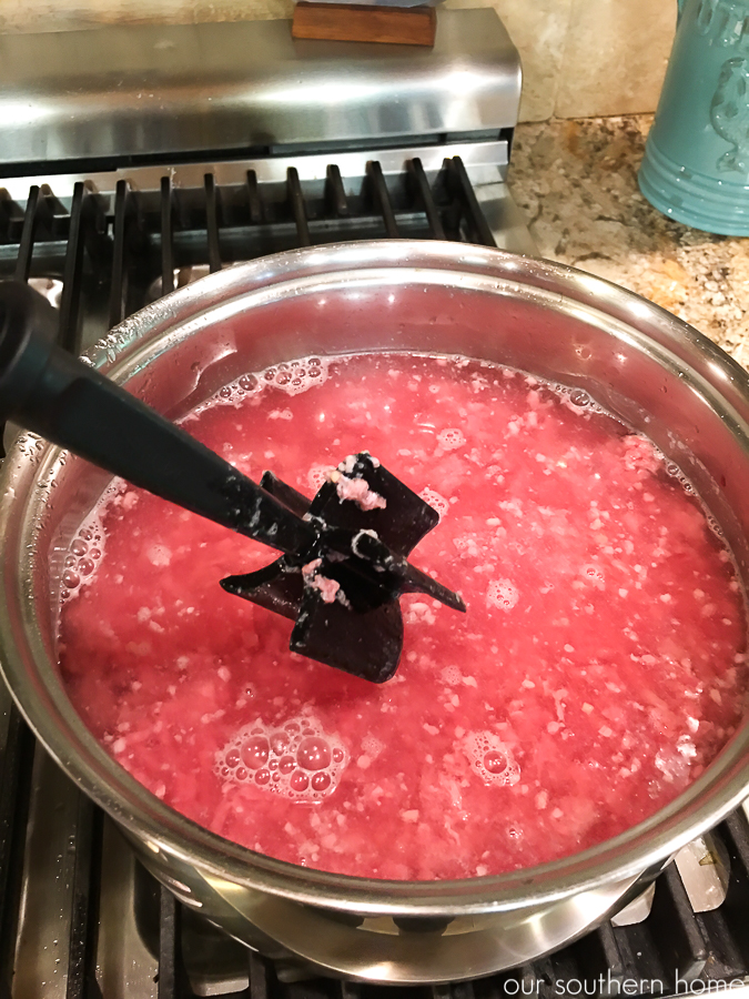 ground beef boiling in pot with water