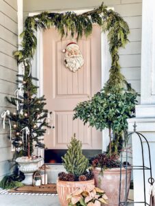 blush colored door with santa wreath