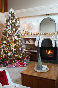 christmas tree by fireplace