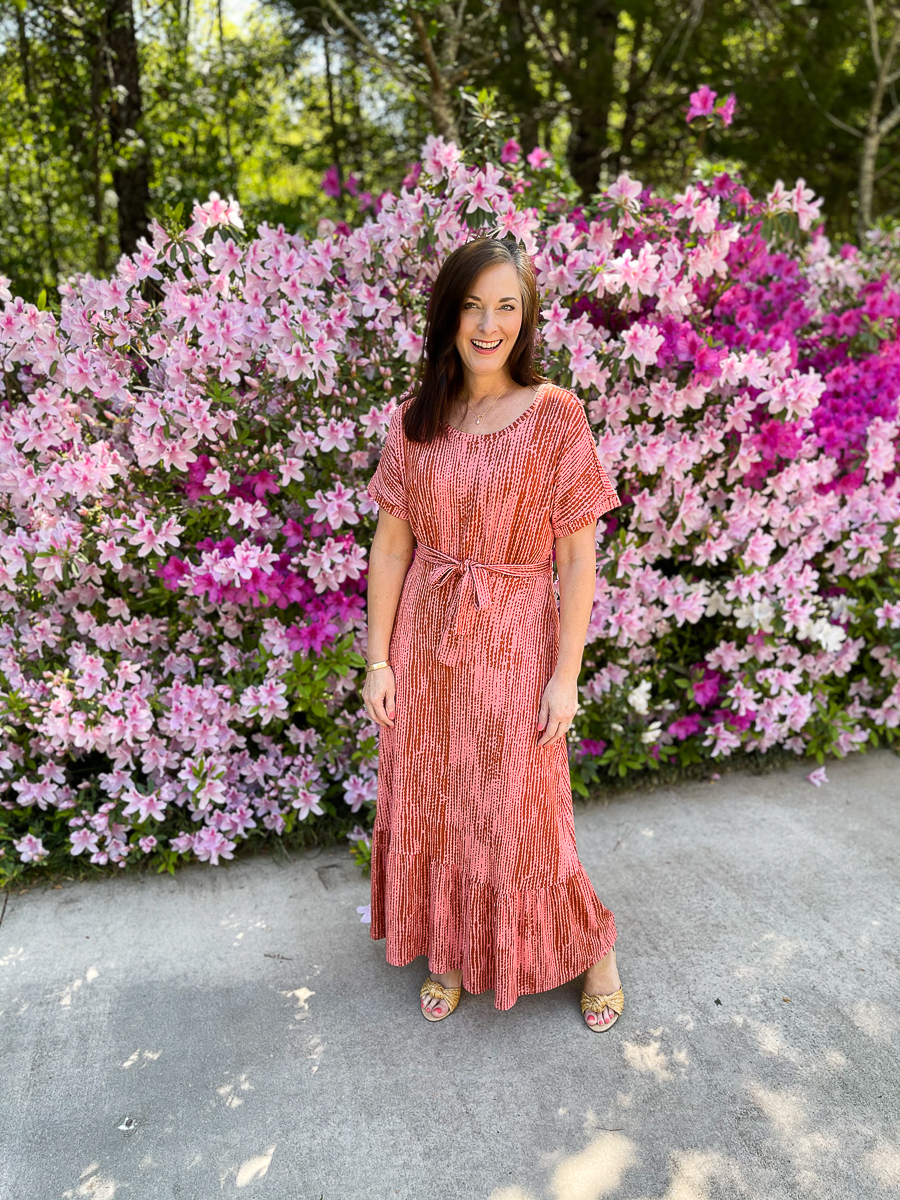 woman in long coral dress for summer