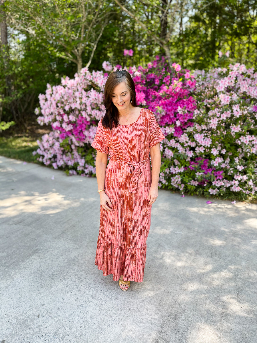 woman in long coral dress for summer