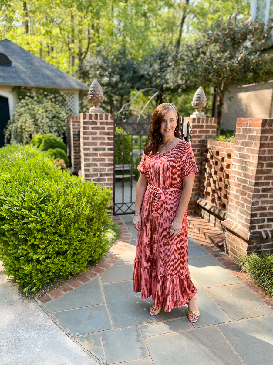 woman in long coral dress for summer