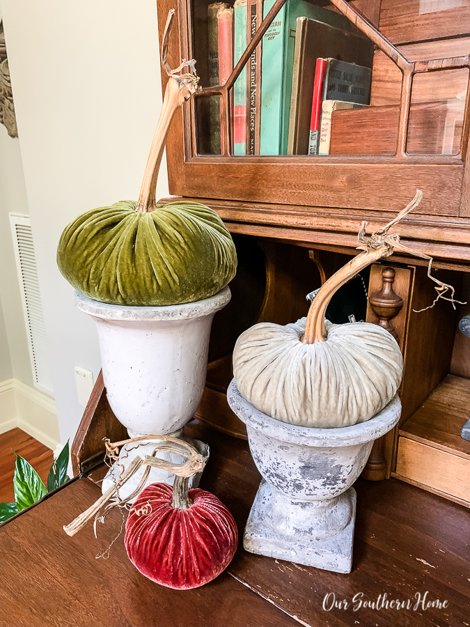 urns with velvet pumpkins