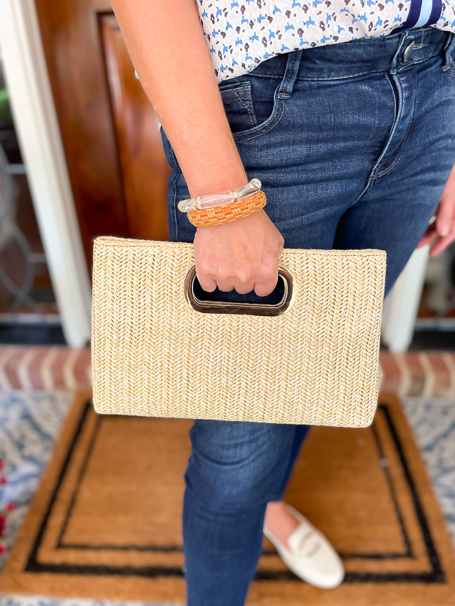 woman holding clutch