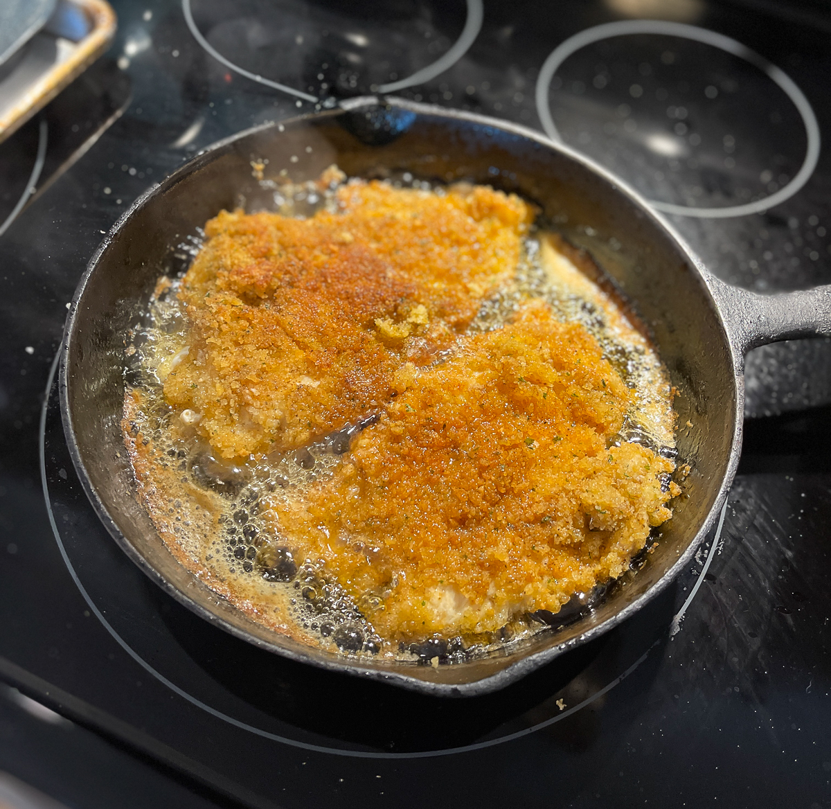 chicken cooking in skillet