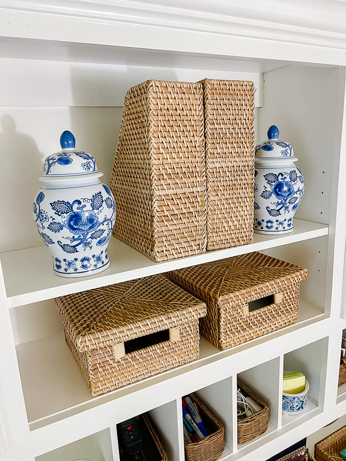 open shelving with blue and white vase