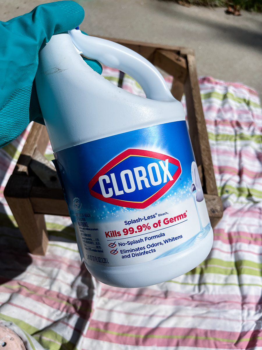 woman holding household bleach