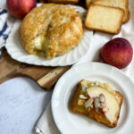 brie with crackers and peaches