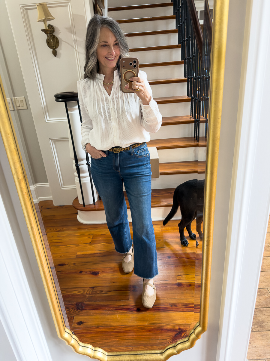 woman in white blouse and jeans