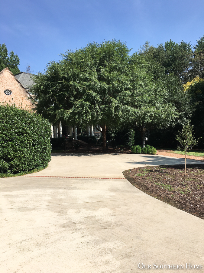 driveway with brick house