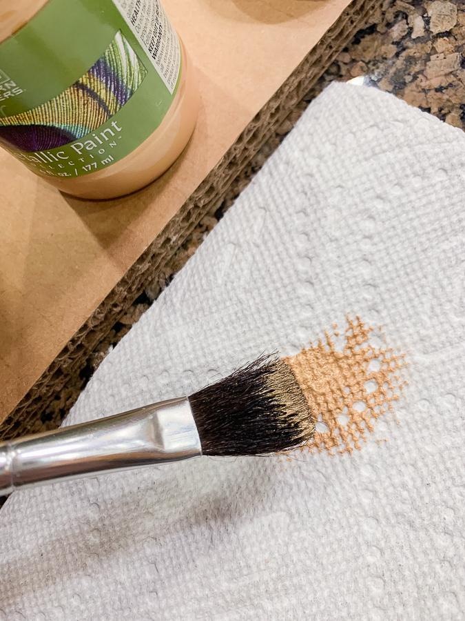 gold paint on a brush