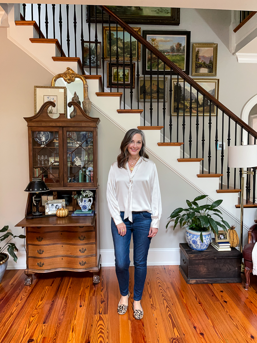 woman in jeans and cream blouse