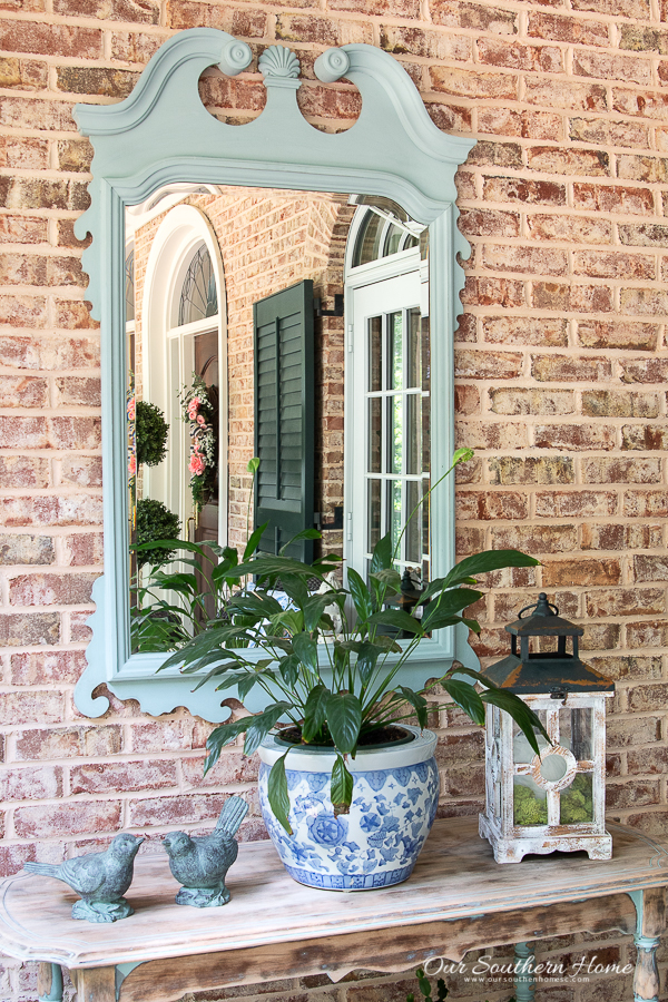 porch console table with blue and white decor