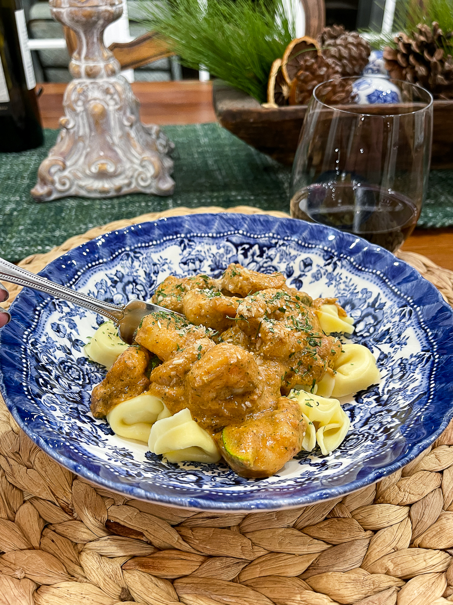 pasta in a blue and white bowl