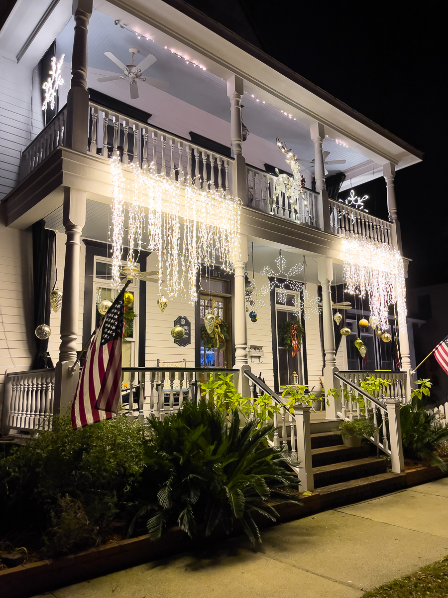 house at night with christmas lights