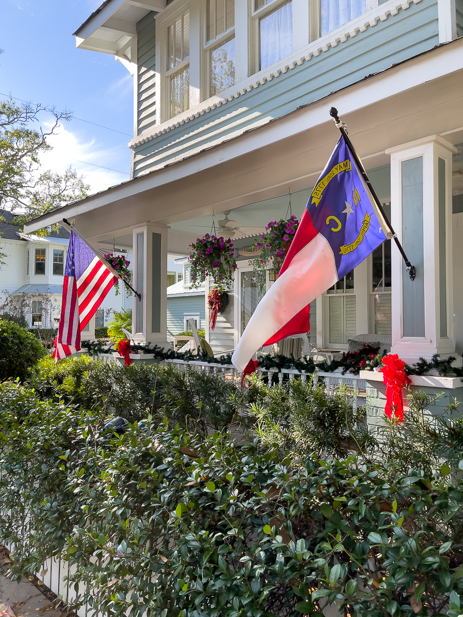 historic home with two flags