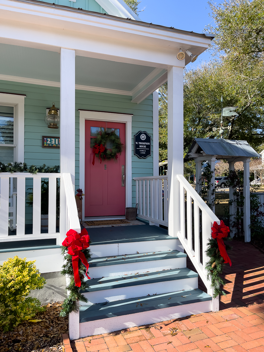 green house with salmon colored door