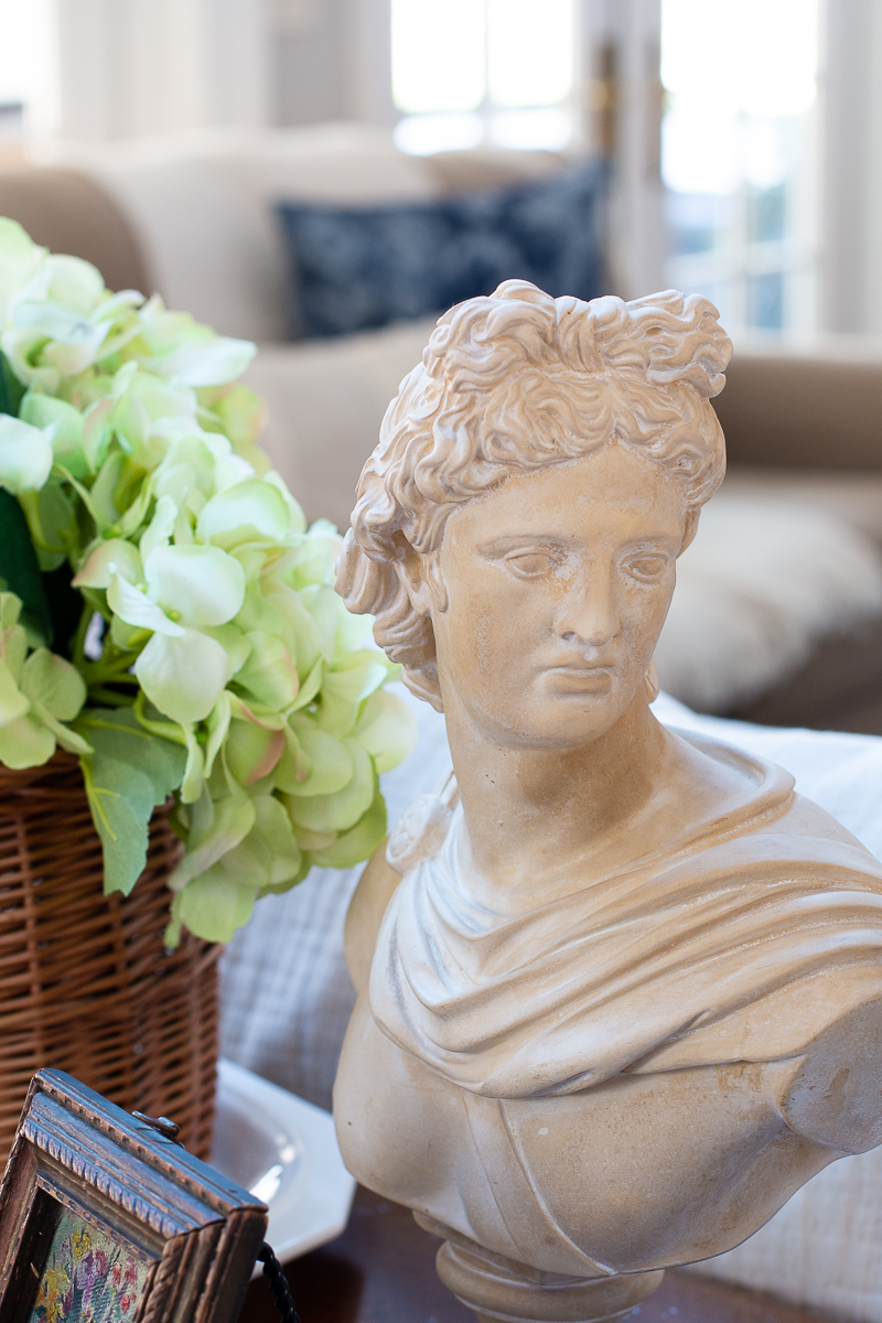 bust statue with flowers