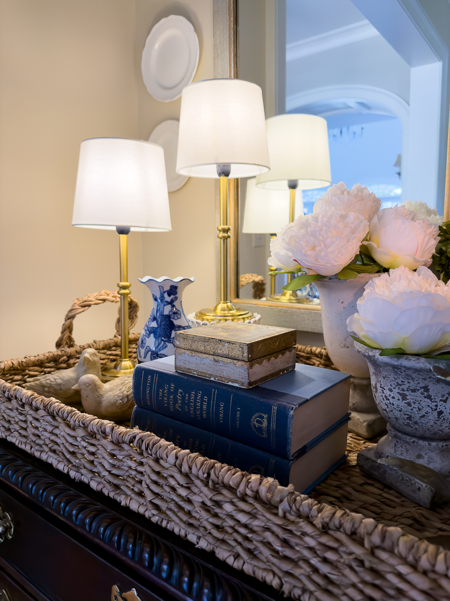 Spring dining room with vintage vignette, peonies, candlelight, and blue and white decor.