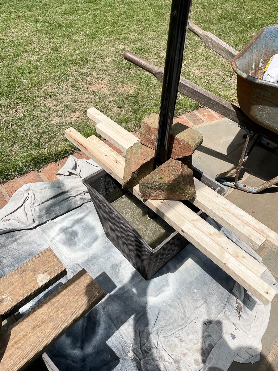 pots with concrete and poles