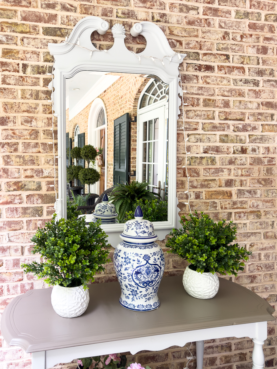 mirror on porch with decor