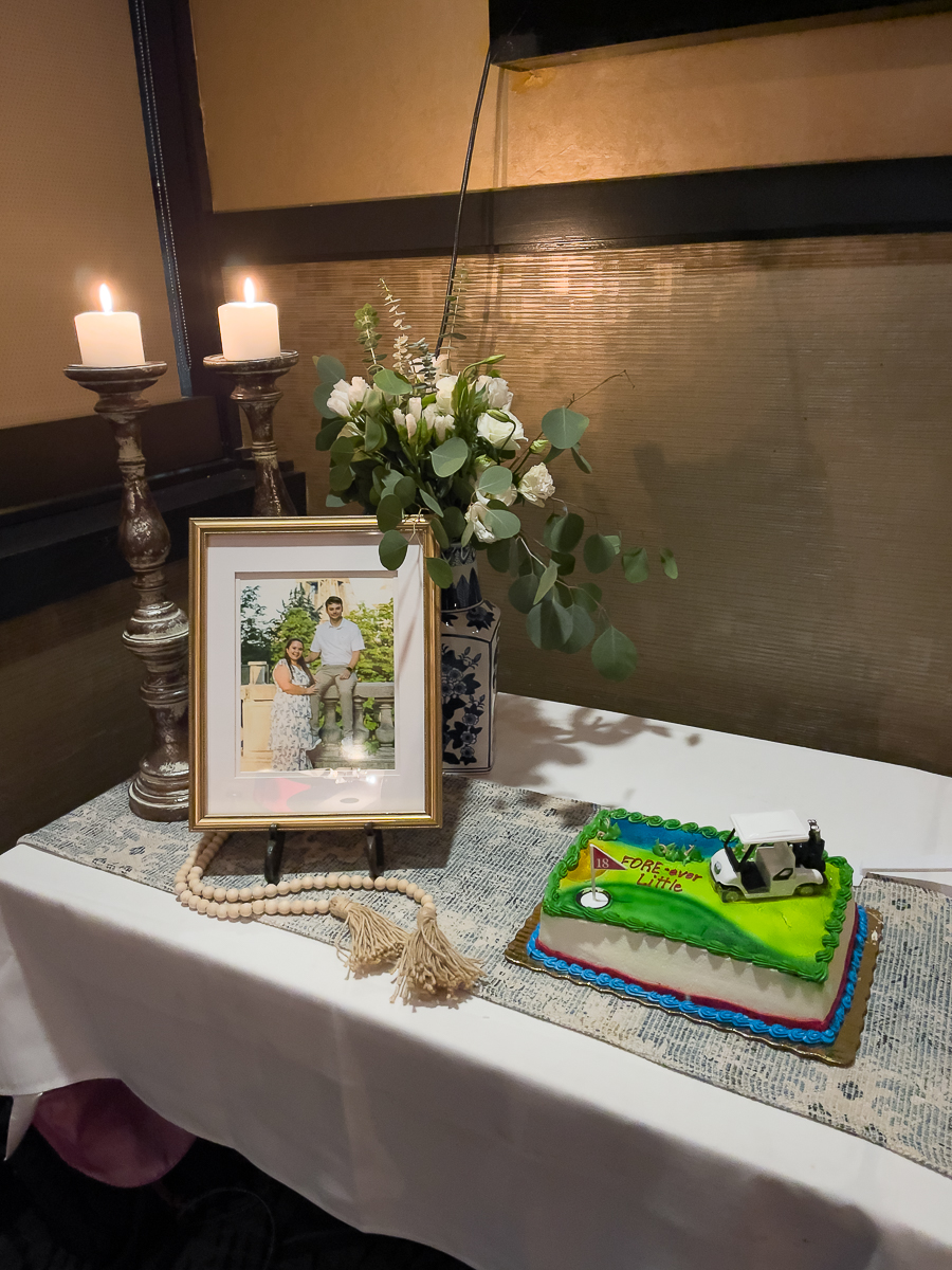 table with flowers and groom cake