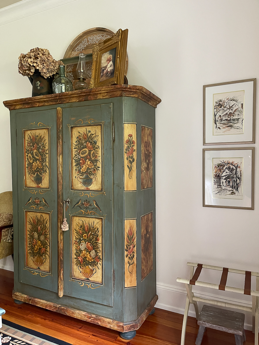 armoire and wall art