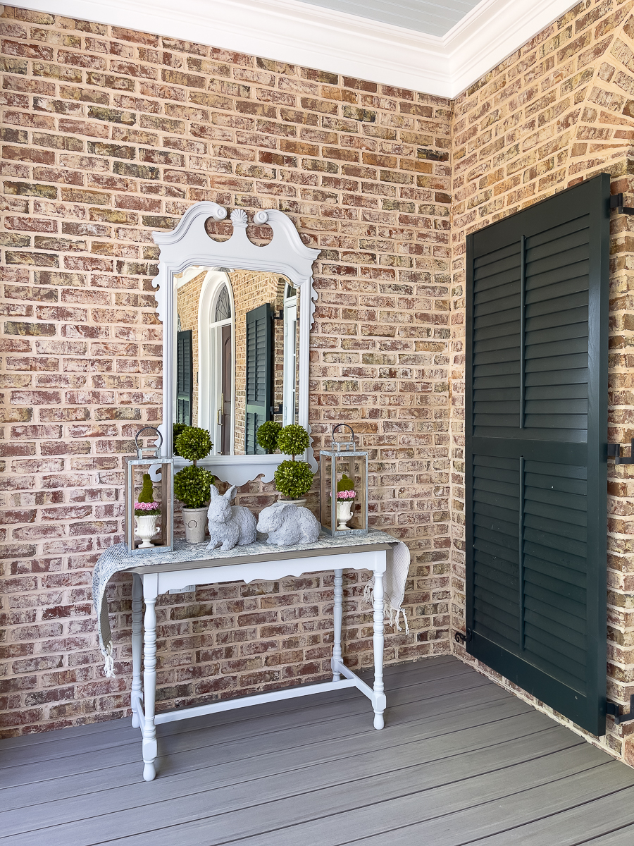 porch with a table and decor