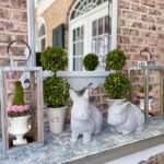 faux concrete rabbit on front porch