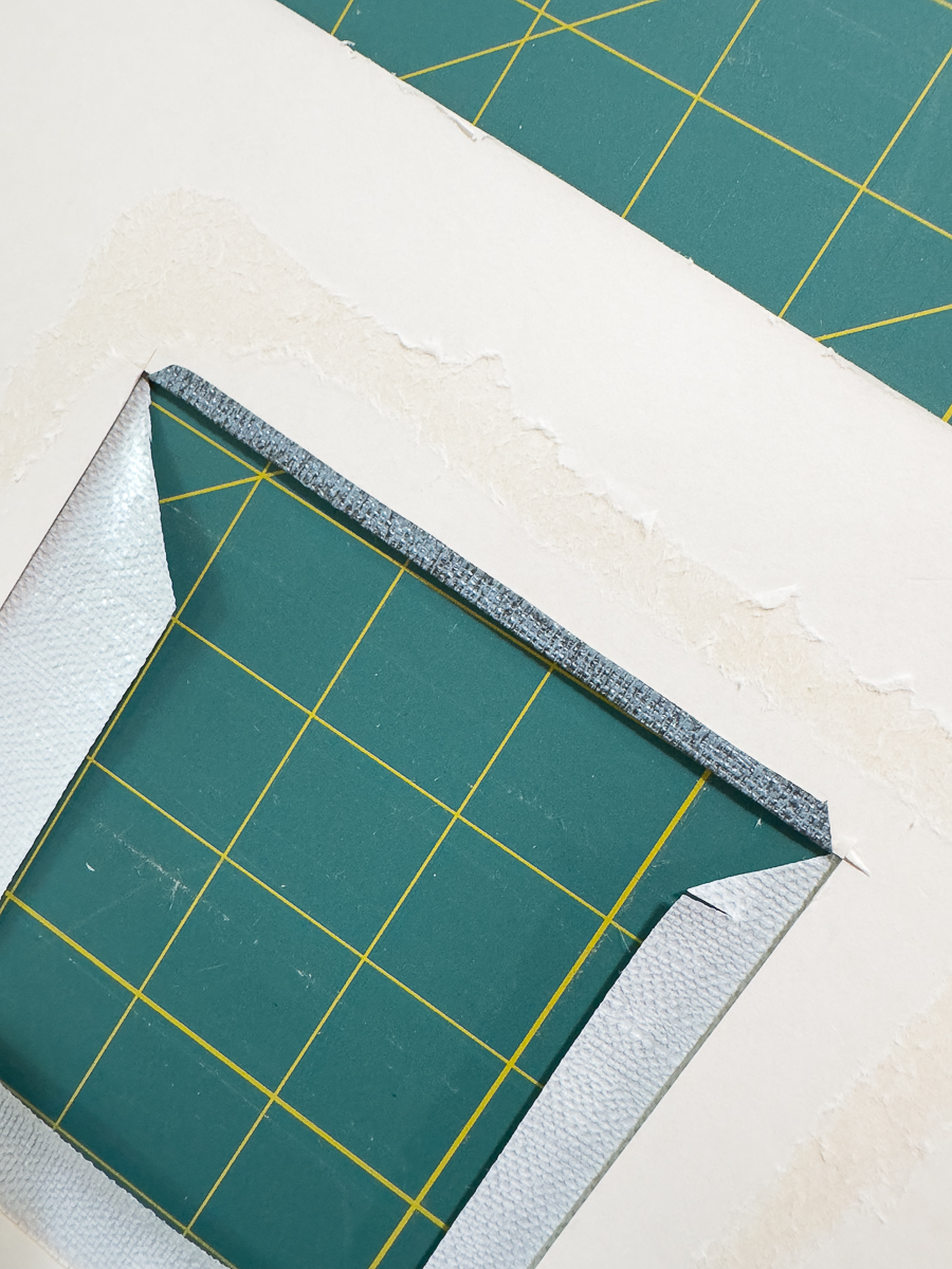 folding grasscloth onto mat