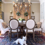 spring dining room with white dog on rug