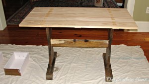 Thrift store trestle table makeover with a new stained top and chalk paint by Our Southern Home