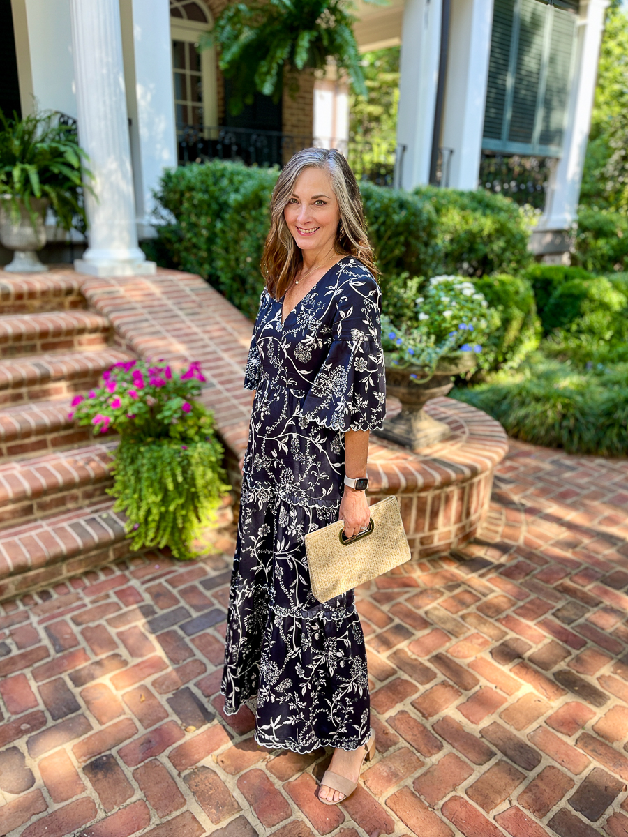 woman in front of house