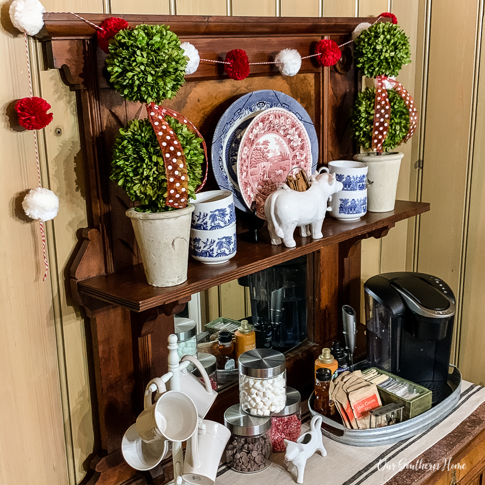 Details for creating a Valentine's Day beverage bar with adorable pom pom garland.