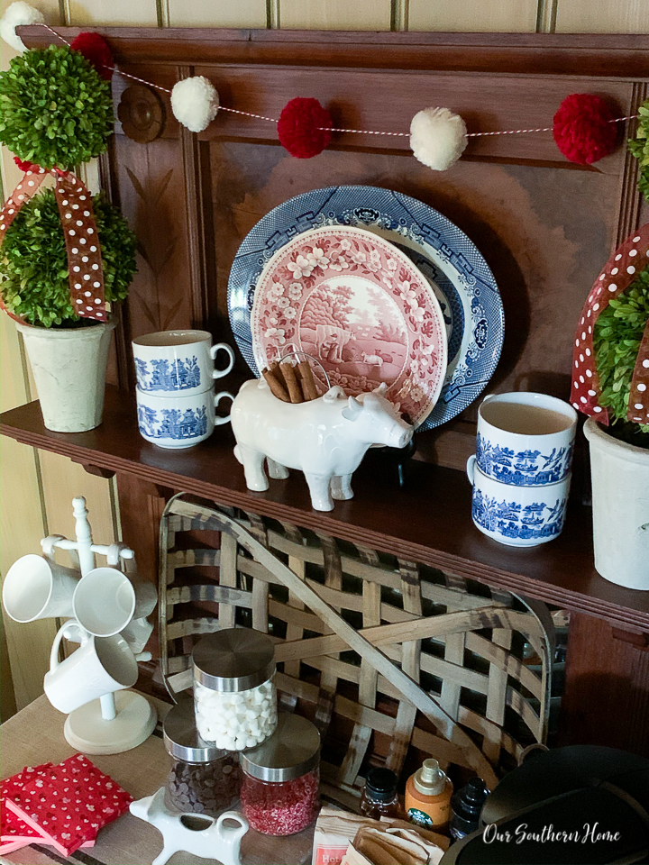 Details for creating a Valentine's Day beverage bar with adorable pom pom garland.