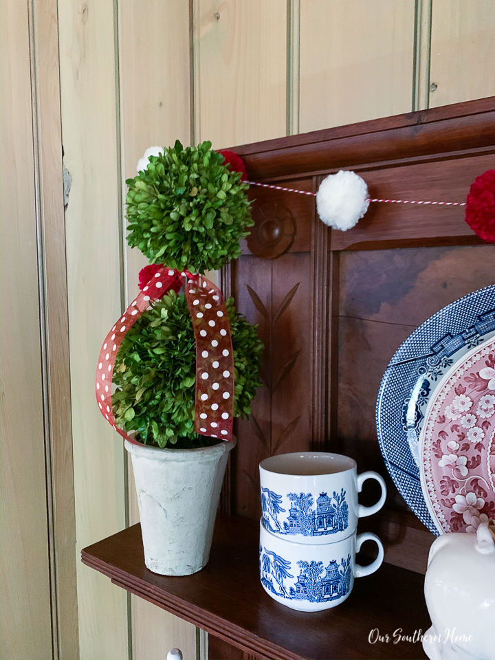 Details for creating a Valentine's Day beverage bar with adorable pom pom garland.