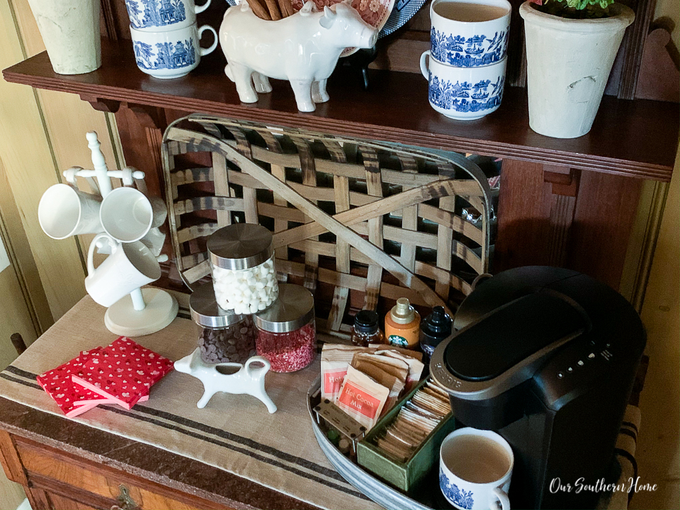 Details for creating a Valentine's Day beverage bar with adorable pom pom garland.