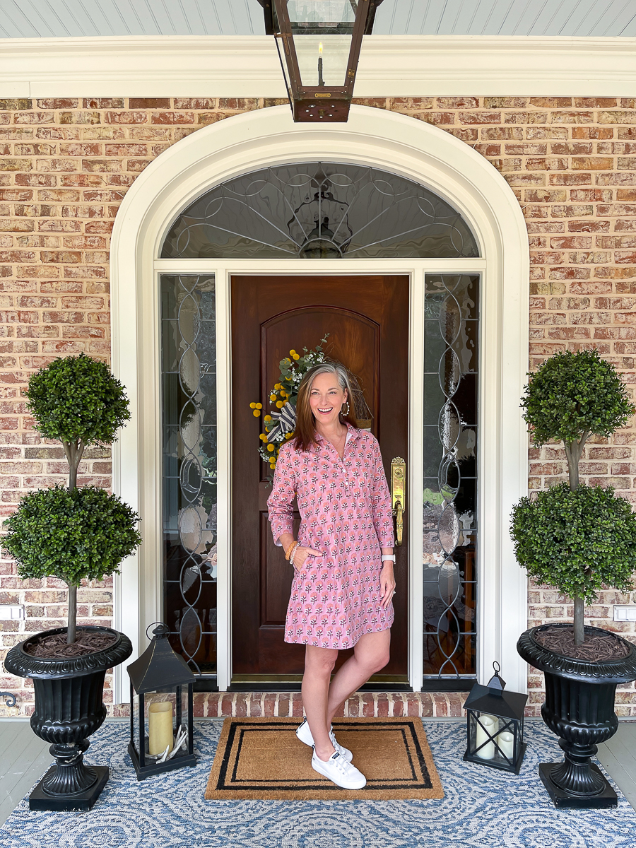 womanin dress on porch