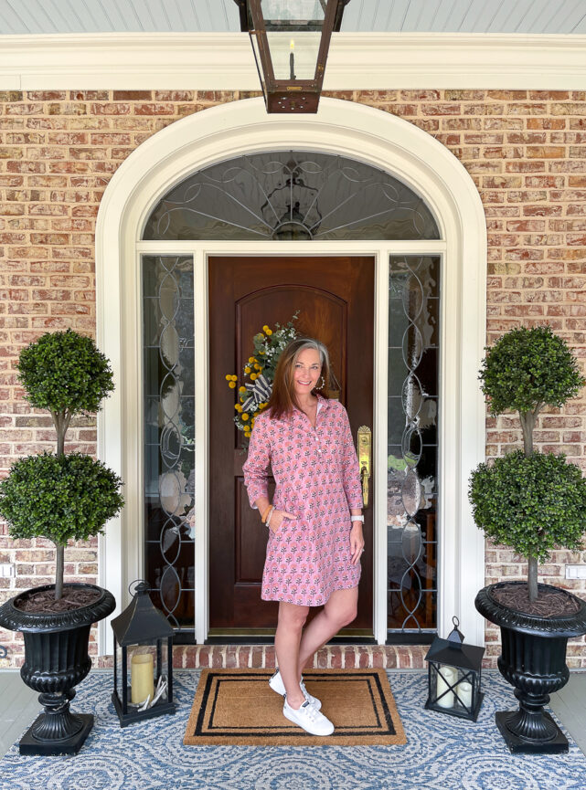 woman in dress on porch