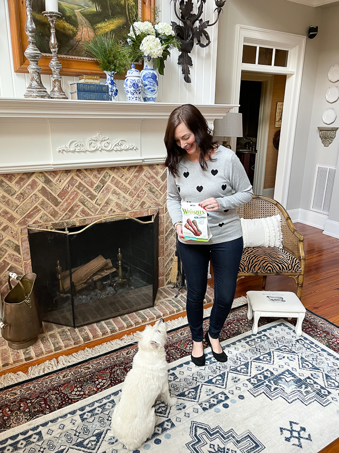 woman with dog and treats