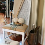 Thrift store chair makeover with spray paint and painted fabric chair cushion.