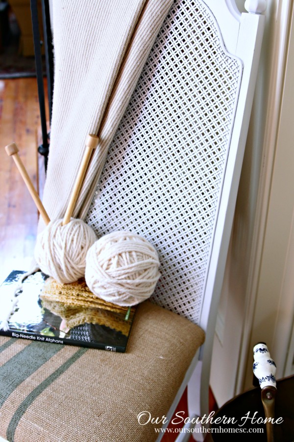 Thrift store chair makeover with spray paint and painted fabric chair cushion.