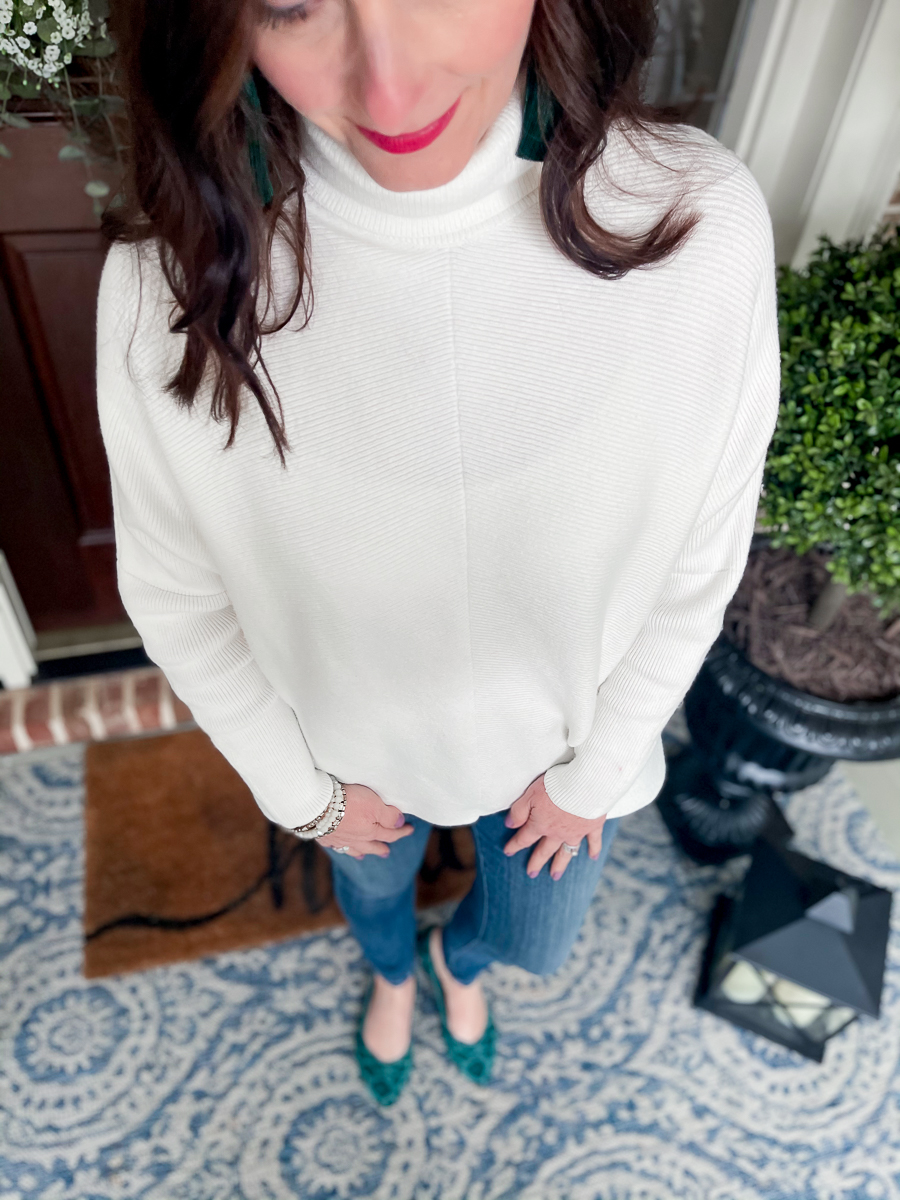 lady in jeans and white sweater