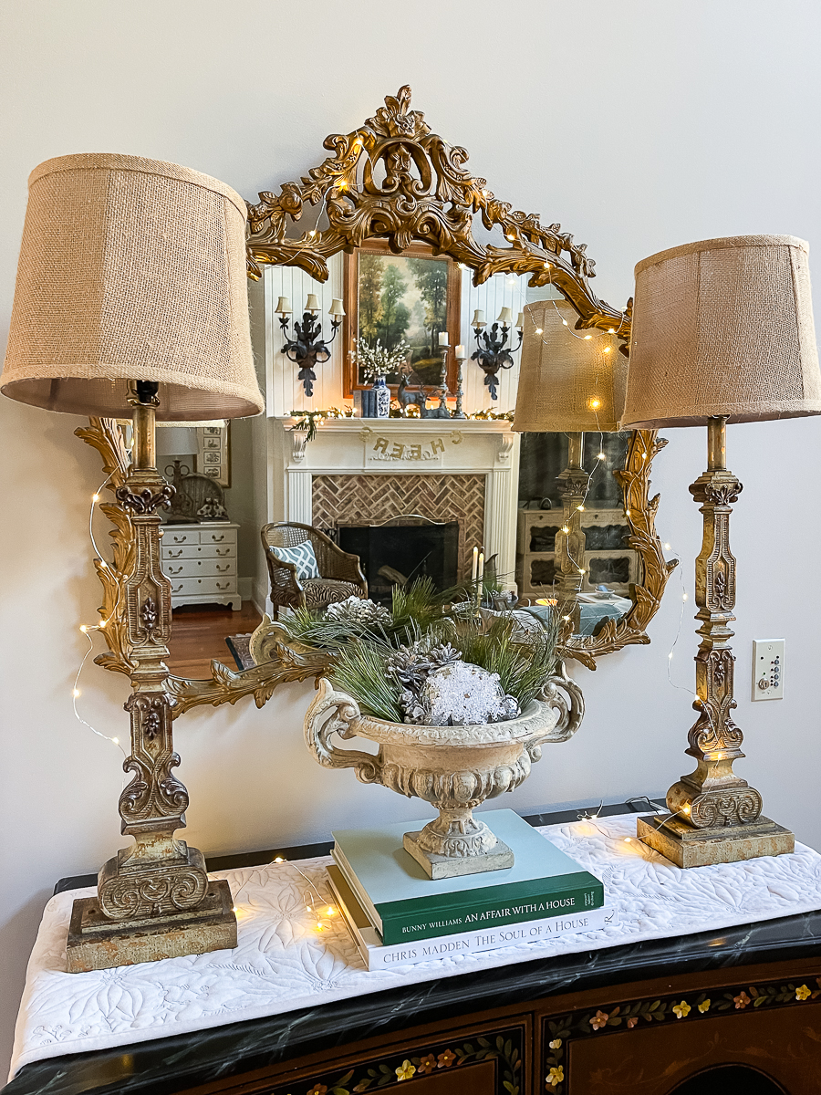 cabinet with two lamps and winter decor