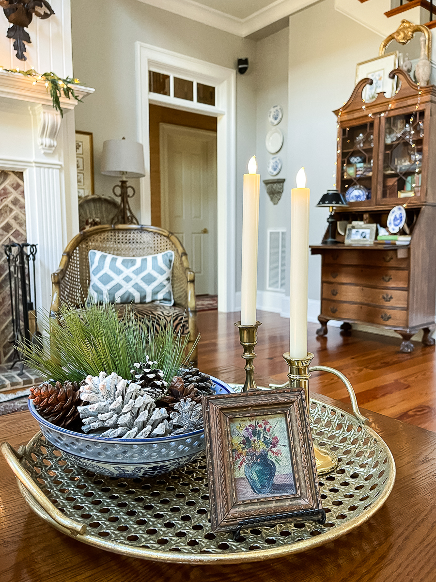 vignette with candles and blue and white bowl