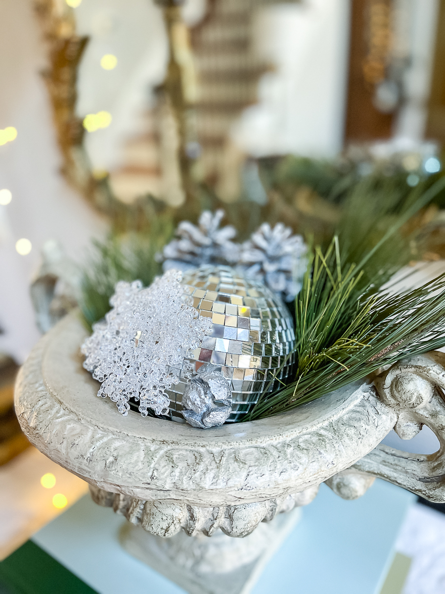 urn with greenery and disco ball