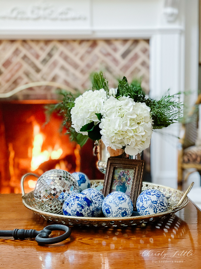 winter floral arranging by fire