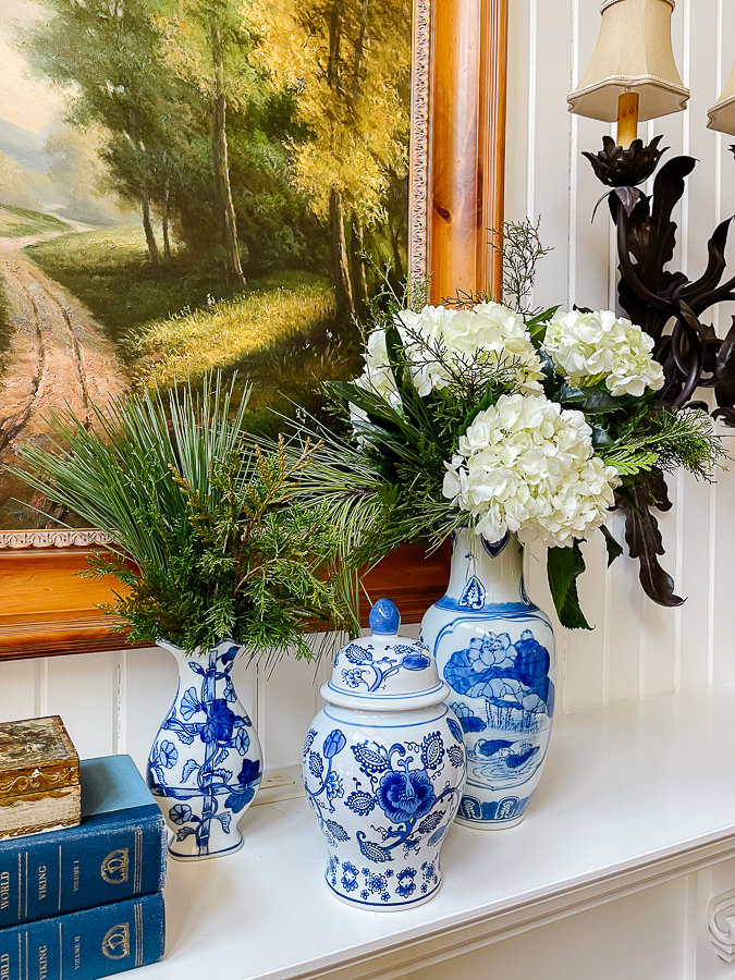 winter floral arrangements in blue and white vases