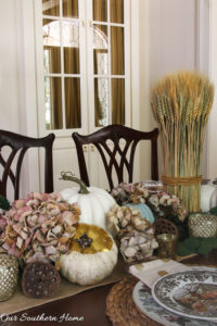 Creating a woodland tablescape for fall by Our Southern Home #falltable #falldecor #falltablescape